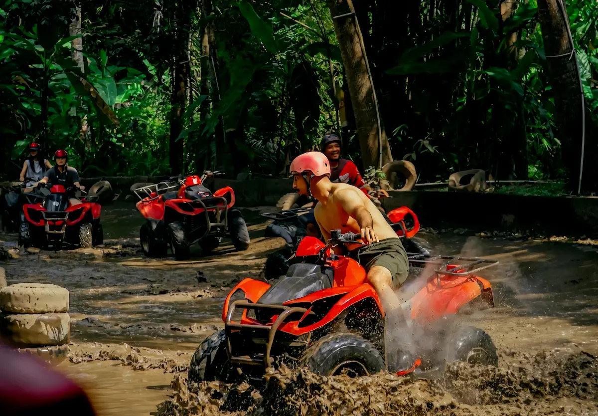 Traveler riding an ATV through mud tracks and jungle trails during a Bali ATV Tour in Ubud.