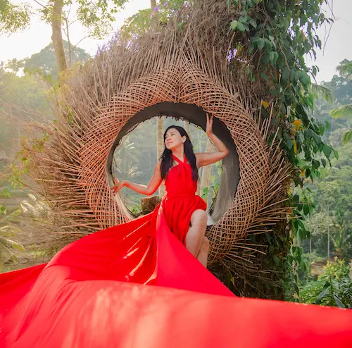 Woman in red flying dress at Bali Photography Tours