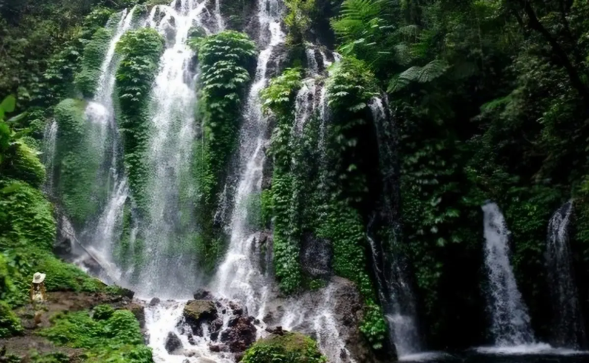 Banyuwana Amertha Waterfall surrounded by lush jungle – Bali waterfall tour highlight