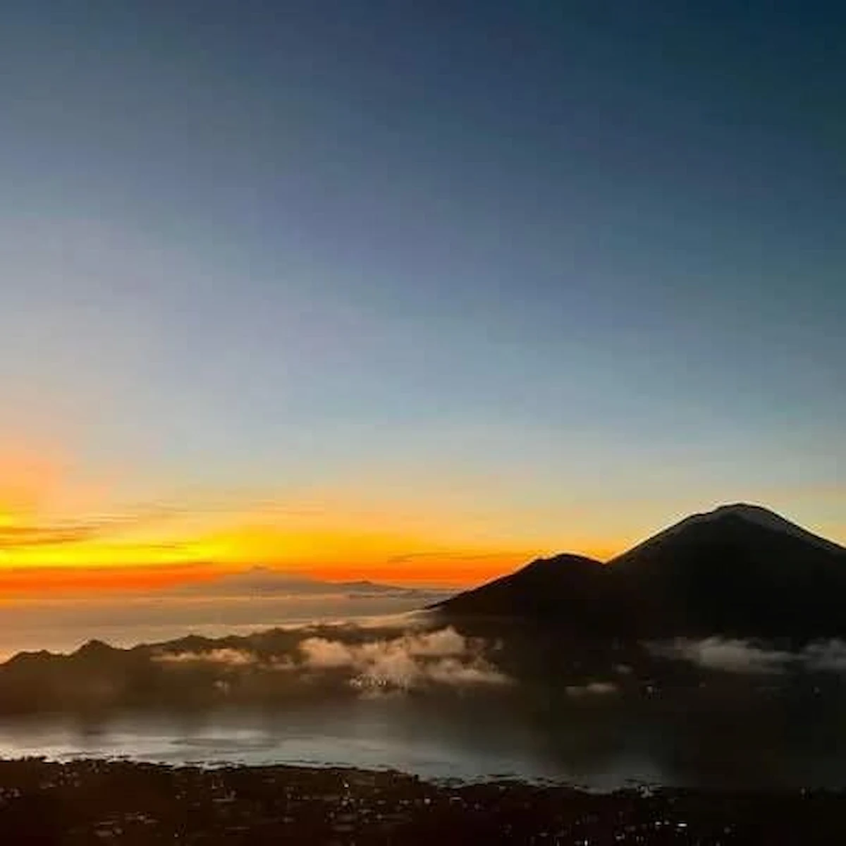 “Breathtaking sunrise view from Mount Batur during a Batur Day Trip, Bali