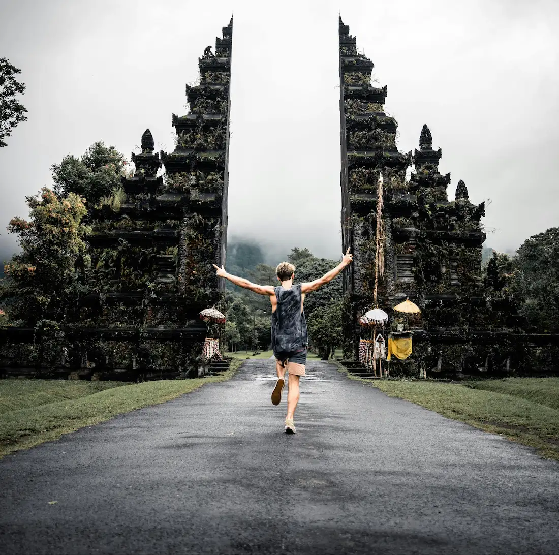 Man taking photo at Handara Gate, North Bali highlight spot