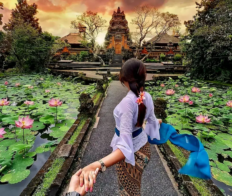 Woman visiting Saraswati Temple during Ubud day trip